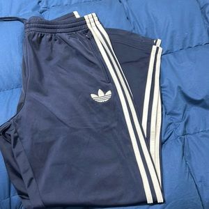 Men’s blue and white striped Adidas training pants size large great condition.